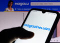 April 15, 2021, Brazil. In this photo illustration the Magazine Luiza logo seen displayed on a smartphone screen with the logo of Magalu in the background